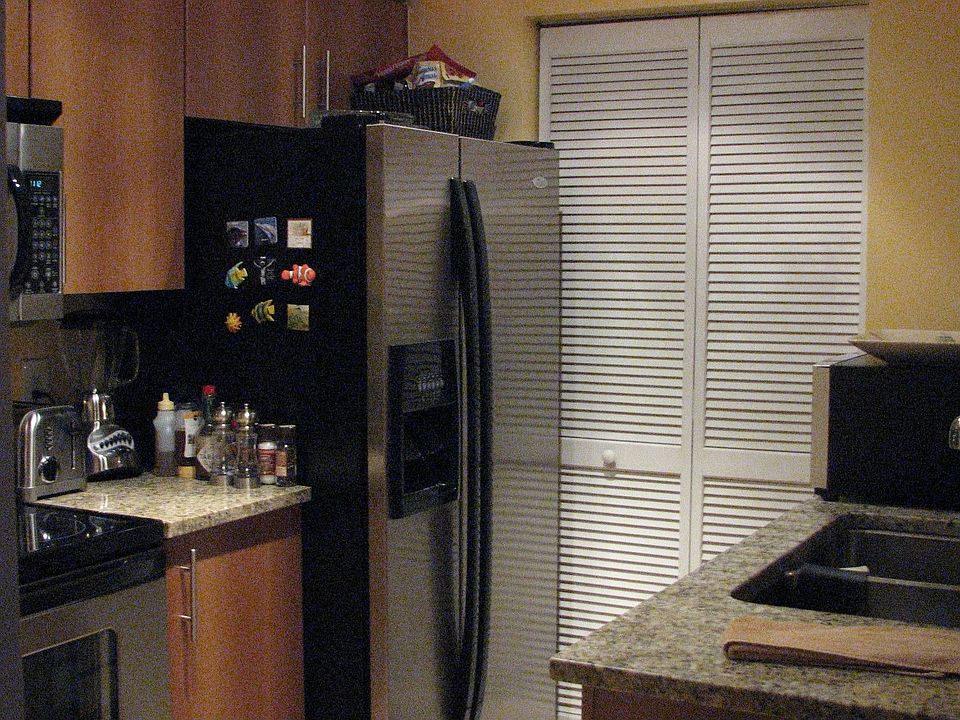 Kitchen has stainless steel appliances