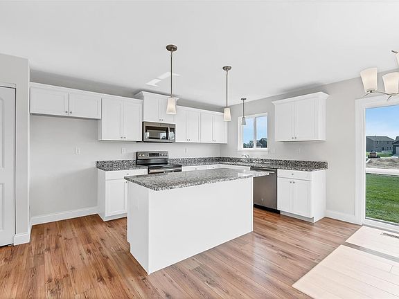 GRANITE COUNTERS WITH STAINLESS APPLIANCES IN SLATE COLOR