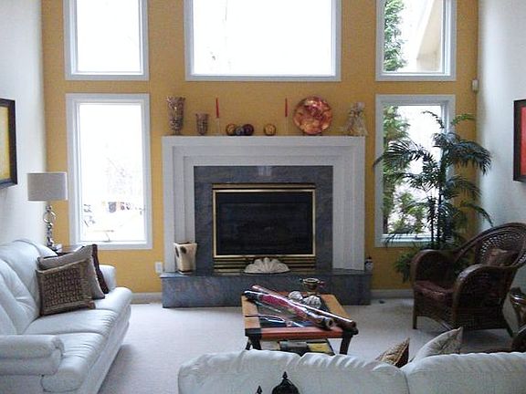 Upon entry to the home you are facing the formal living room with an elegant fireplace and array of 