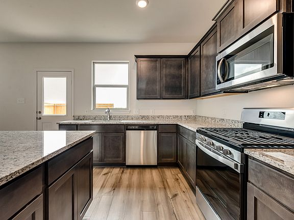 The kitchen comes with a full suite of stainless steel appliances!