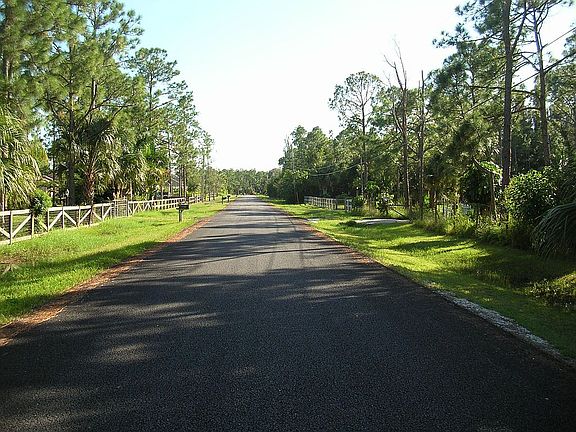 Looking south on 121st Terrace at property, newly paved.