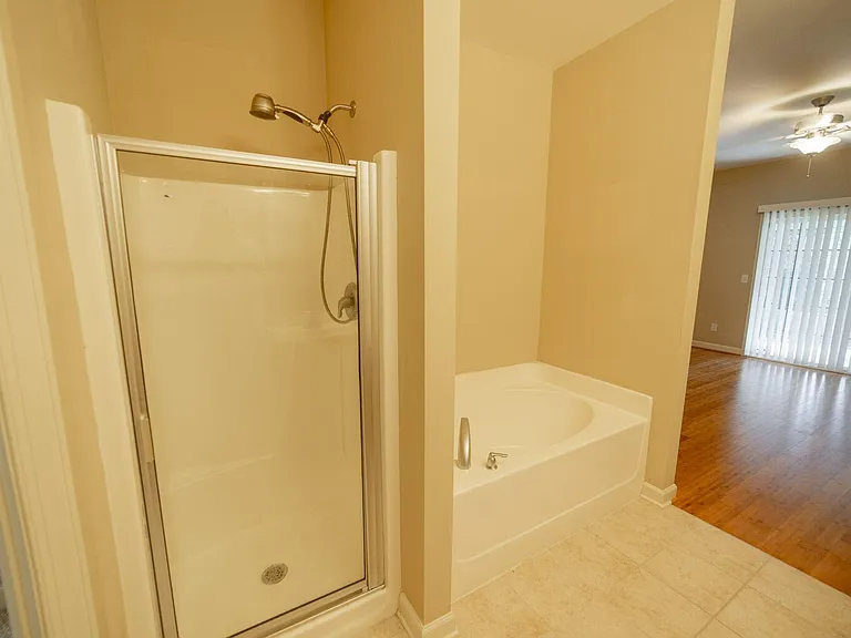 ENSUITE BATHROOM WITH VIEW OF WALK-IN SHOWER