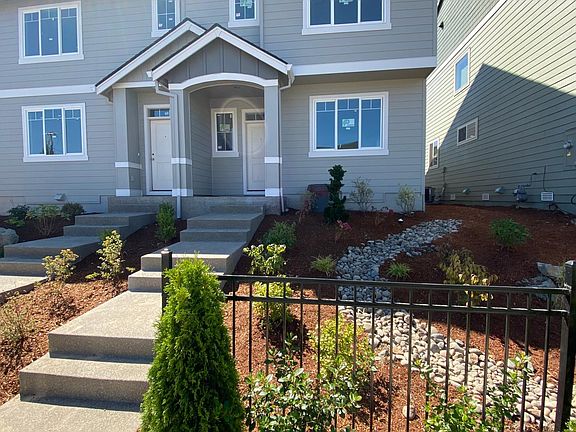 Porch has room for one patio chair. Master bedroom is above the front door and has a beautiful view out the window.