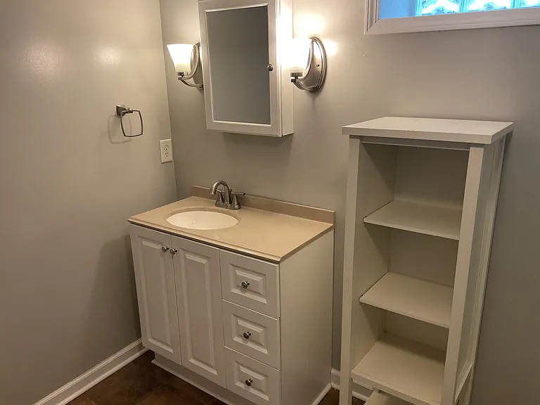 Lower Level Bathroom is very spacious and includes lots of storage for extra towels and toiletries.