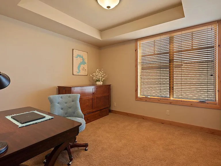 2nd bedroom furnished as/functions as an office with huge walk in closet with shelves