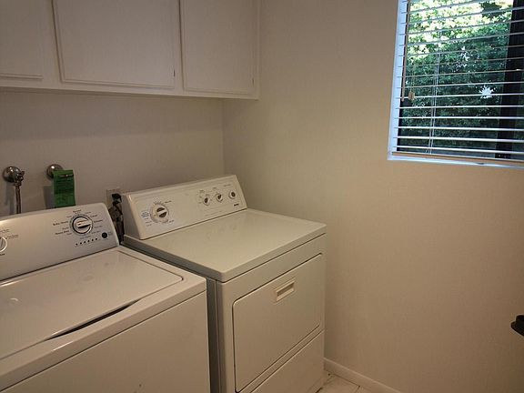 Indoor laundry room with washer and dryer