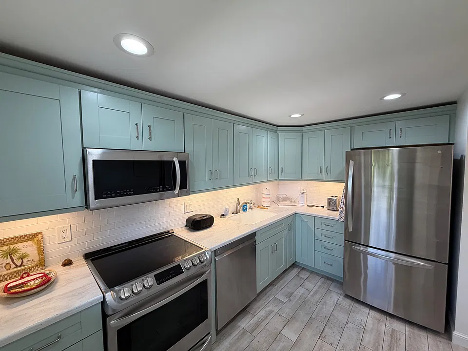Martha Stewart designer cabinets, new appliances and hot-water tap for hot beverages.
