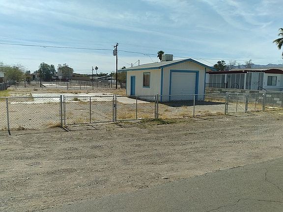 Lot is fenced with gates