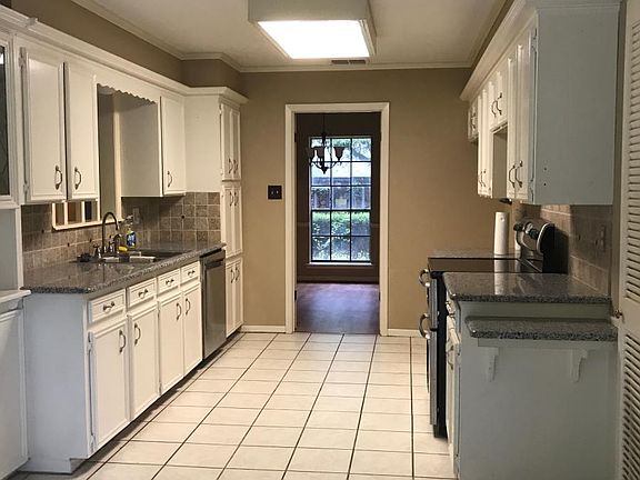 Kitchen and dining room view from breakfast nook.