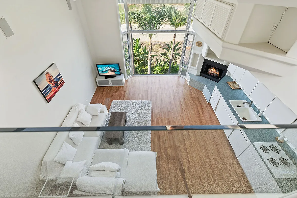 Expansive Living Kitchen area with floor to ceiling windows and Huntington Harbour views - 24-C Pacific Ave