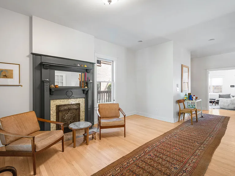 First Floor Living Room Area with View into Family Room