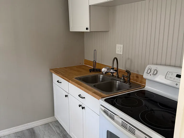 Stove/oven combo, sink, and plenty of storage