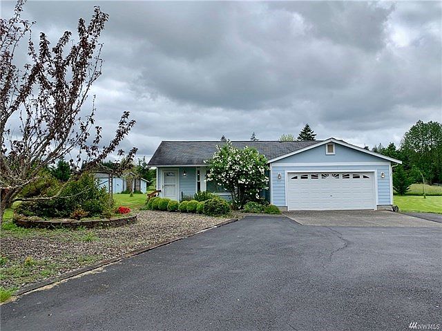 Front of home with lovely easy-to-maintain landscaping.