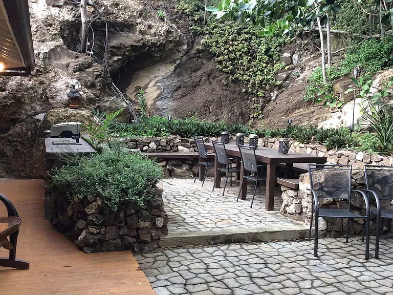 The patio is surrounded by volcanic buildup rocks completely private and natural