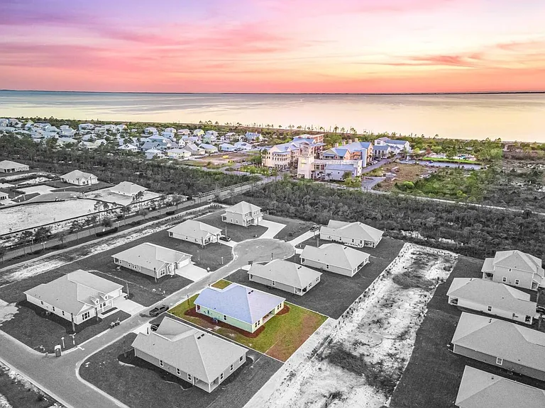 Easy walk or short golf cart drive to town center, resort style pool, playground, or beach.