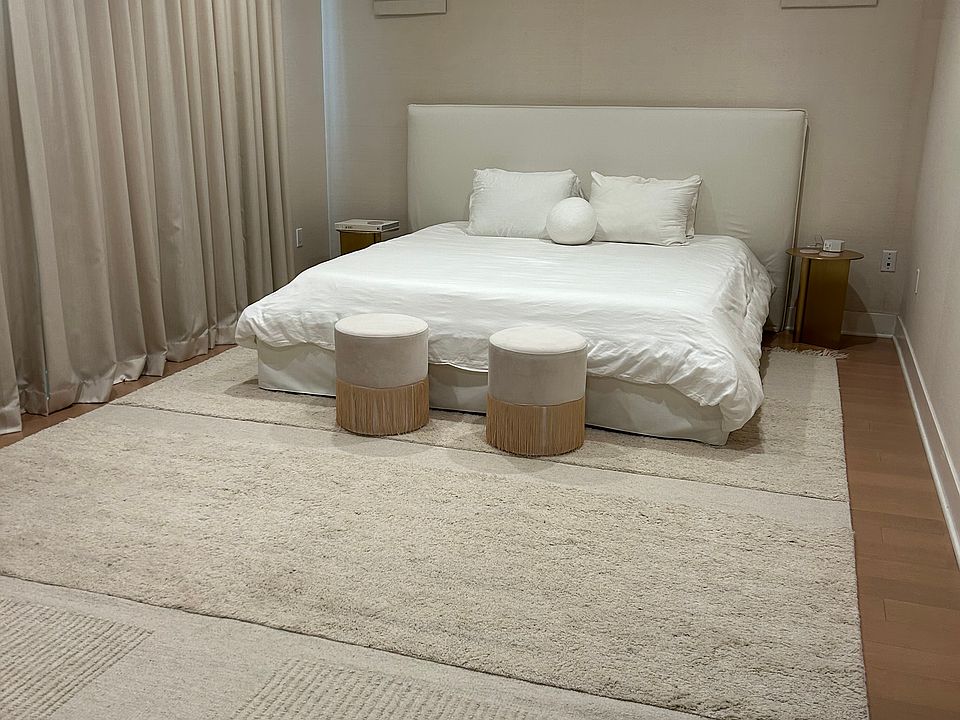 primary bedroom with blackout drapes and shades