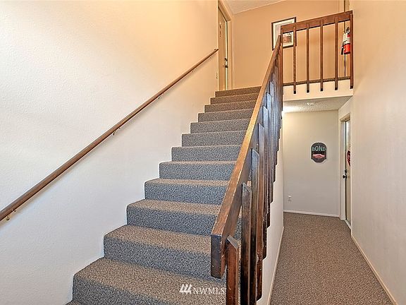 The stairs to the garage are through the door around the corner.