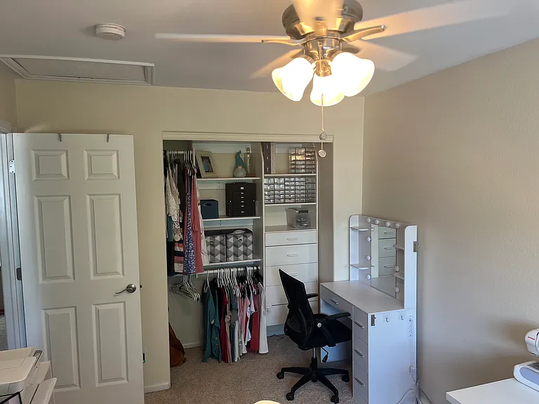 Large closet with organization in 3rd bedroom