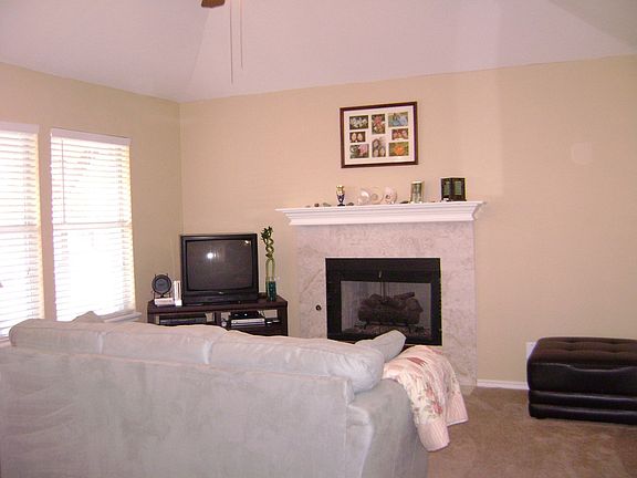 View of the living room from the hallway leading to the garage