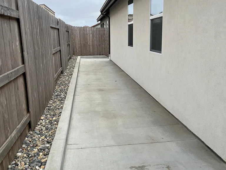 No maintenance back yard designed to give wheelchair access around entire yard.
