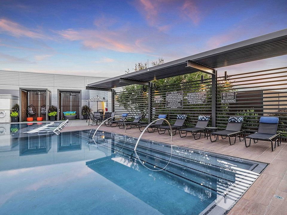 North Building Rooftop Infinity Pool with Outdoor Lounge and Cabanas