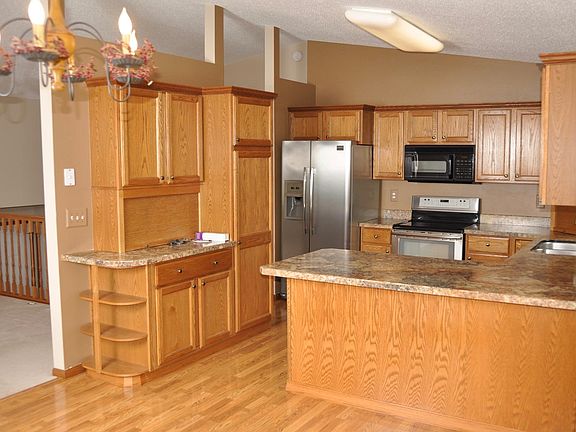 Kitchen open to dinning room and walks out on screened porch