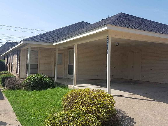 Rear entrance with covered patio and 3 car parking