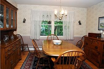Formal dining room has chair rail trim