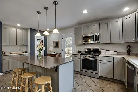 Large beautiful kitchen with ceramic tile floors.