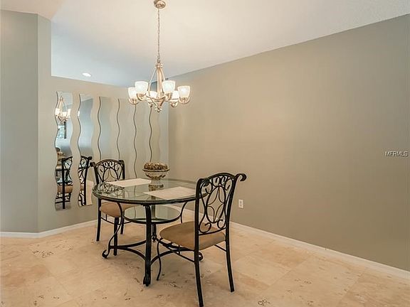 Dining area with mirrored wall.