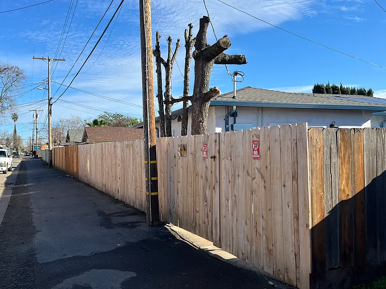 Entrance to the house on 319 Eden St is in the alley right behind 317 Eden St. Wooden gate has lock on handle. You would put your trash cans along the fence next on the side of that utility pole that is opposite to the gate.
