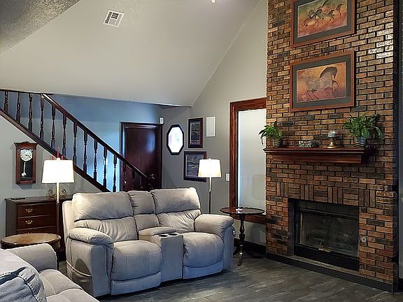 Lroom w wood burning fireplace