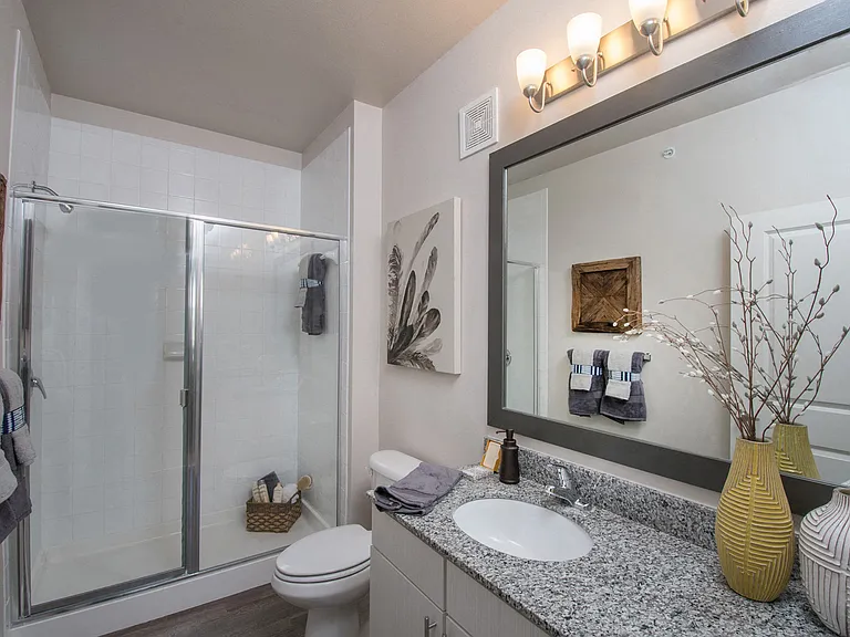 Select homes feature glass-enclosed walk-in showers