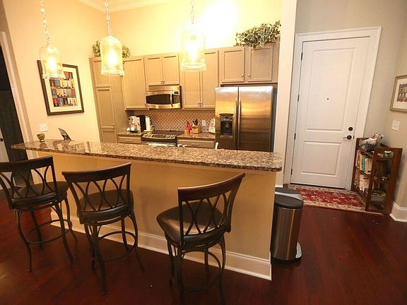 Bar area, hardwoods in kitchen, living, dining areas