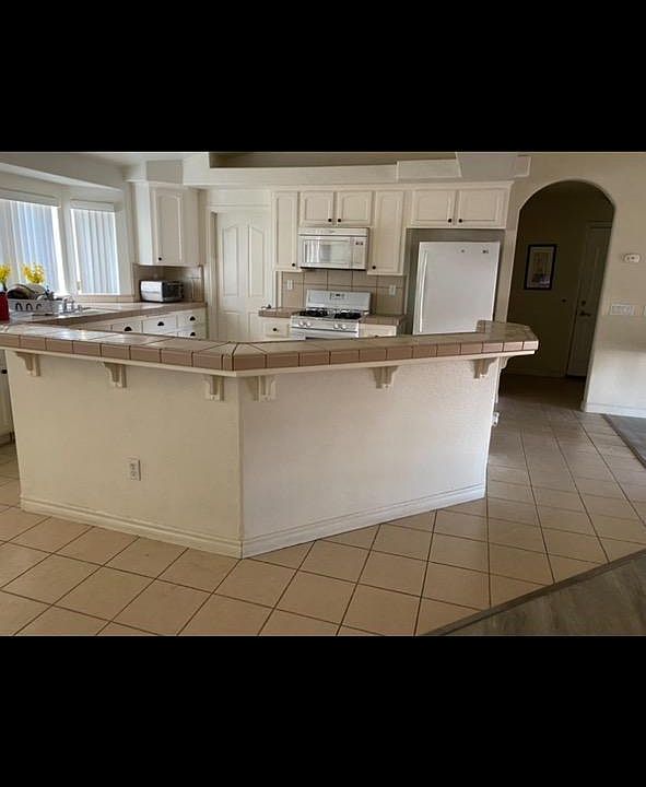 This is the kitchen in the first home for rent.