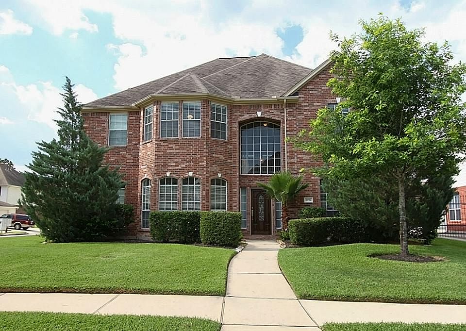 This beautiful home is located on a large corner lot with detached garage and landscaped yard.