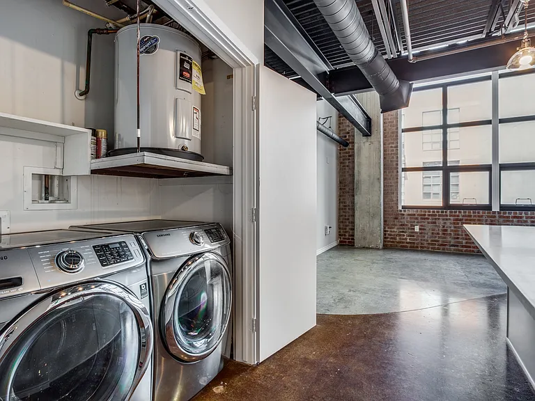 Enjoy the convenience of an in-unit utility closet equipped with a front-loading washer and dryer set, included as part of the lease, making laundry day a breeze.