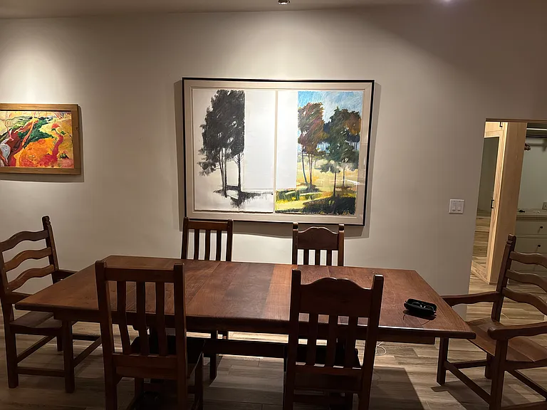 Custom walnut dining table and local art