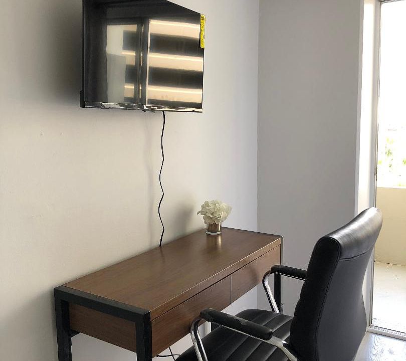 UNIT COMES WITH DESK AND CHAIR (DIFFERENT ONE, NOT IN PICTURE) AND FLAT SCREEN TV.