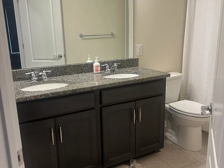Upstairs bathroom with double sinks