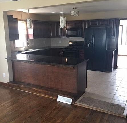 Beautiful kitchen open to living area.