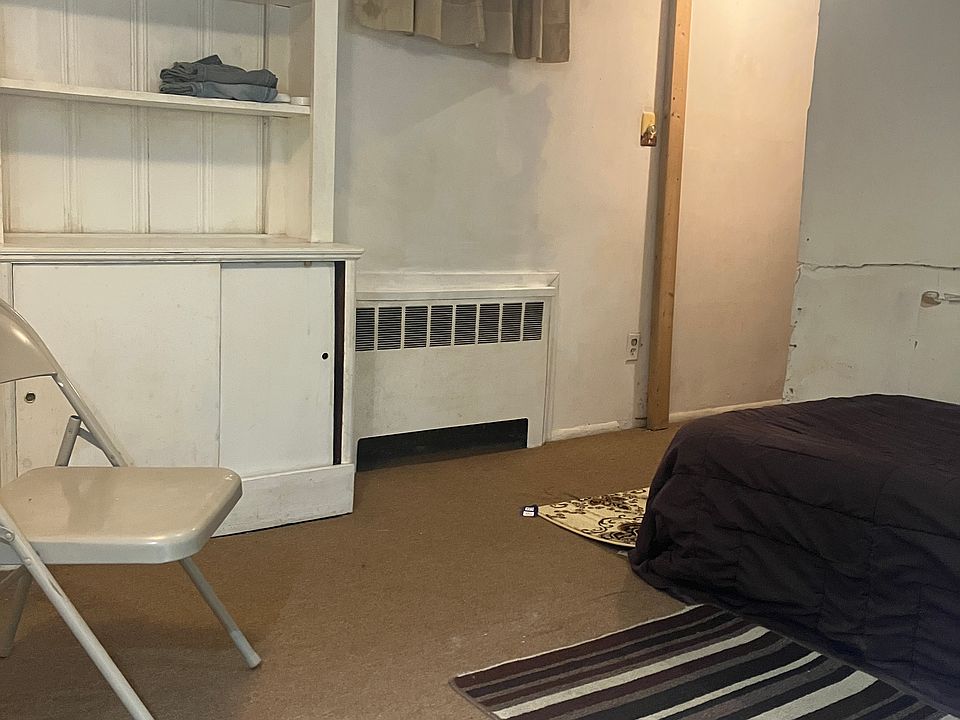 BDRM w twin bed, radiator, exit to kitchenette