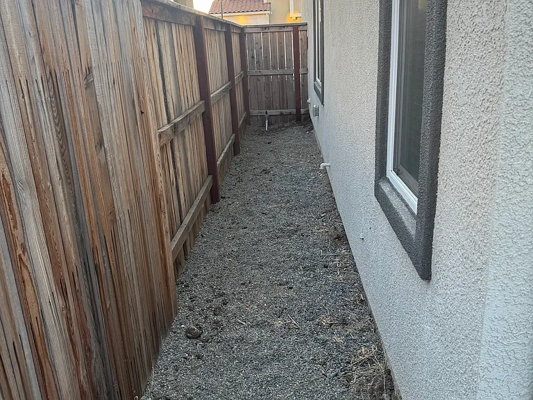 Side Yard with peak gravel for pets