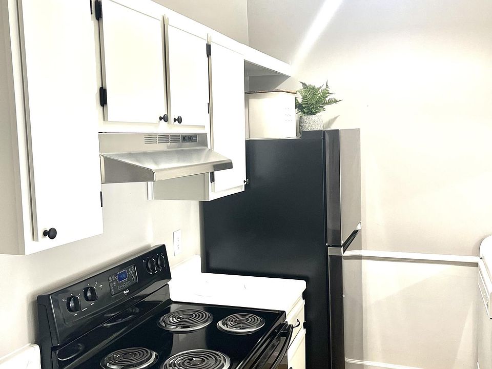 freshly painted cabinets and newer appliances