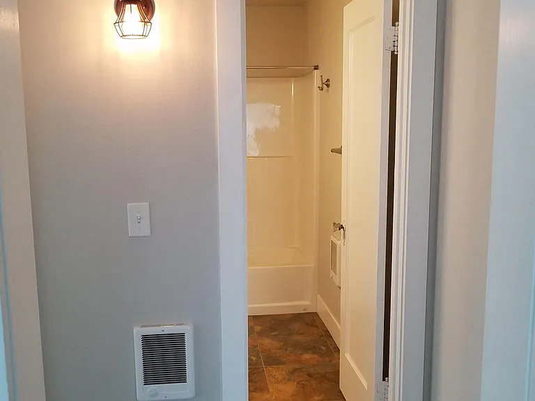 Hallway leading from living room to bathroom and bedroom