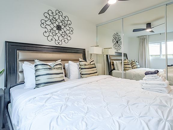 Recharge in this peaceful second bedroom, complete with a cozy bed, stylish decor, and a flat-screen TV, making it your perfect retreat.