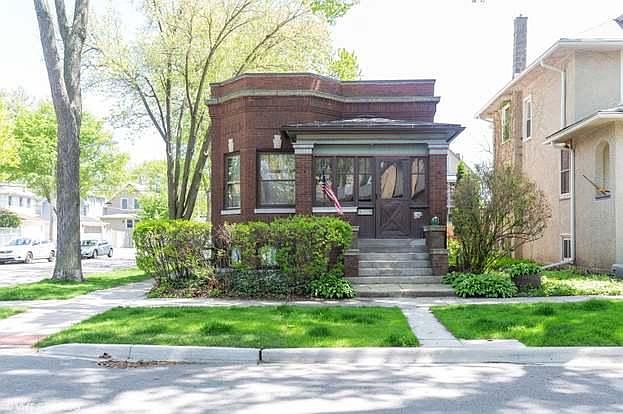 Front of property with view of enclosed front porch. Windows open for morning coffee on the porch!