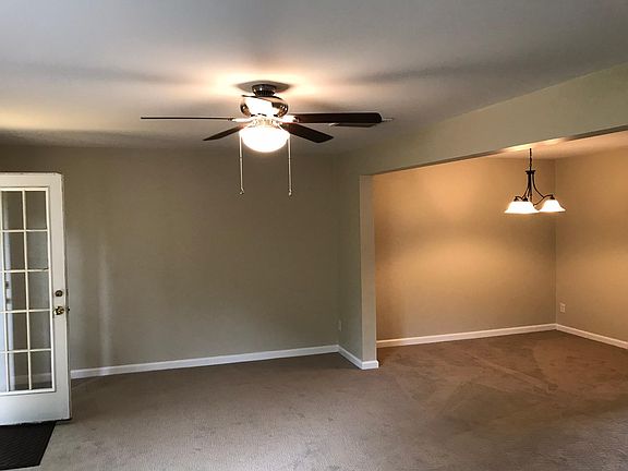Large open floor plan. New lighting in Dining Room.