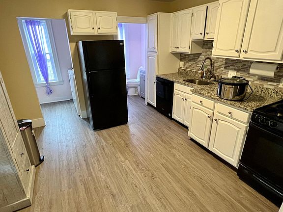 Full kitchen with dishwasher and garbage disposal