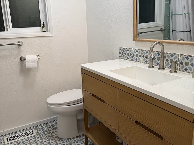 Gorgeous, completely renovated bath, with brand new bathtub/shower combo, tile floor, new efficient toilet, new Signature Hardware vanity and sink.